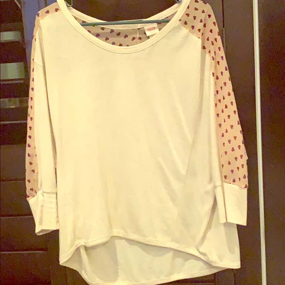 Asymmetrical light sweater.